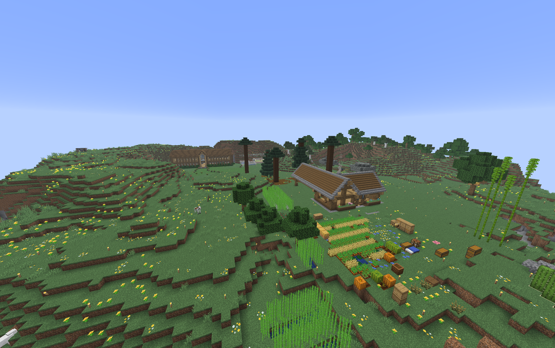 Castle Crafters landscape — rolling hills, a small village, and farmland